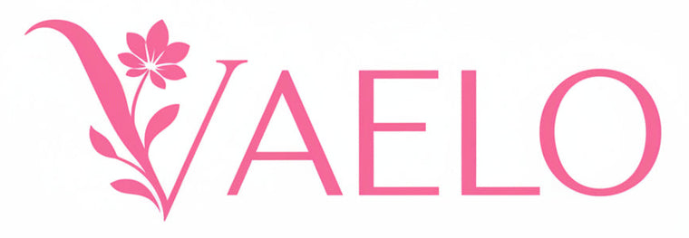 Pink VAELO logo with a stylized floral V on a plain white background.